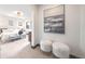 View of main bedroom featuring ensuite bathroom, light-colored walls, and plush seating at 1100 S Gilpin St, Denver, CO 80210