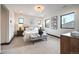 Bedroom with carpet, neutral tones, three windows, upholstered headboard and seating at 1100 S Gilpin St, Denver, CO 80210