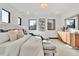Bright main bedroom features modern lighting, large windows, and a hardwood console table at 1100 S Gilpin St, Denver, CO 80210