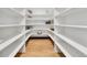 Walk-in pantry with ample shelving, storage space and hardwood floors at 1100 S Gilpin St, Denver, CO 80210