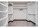 Walk-in closet features custom shelving and ample storage space for an organized wardrobe at 1100 S Gilpin St, Denver, CO 80210