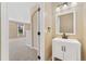 Updated half bath features a new vanity, modern fixtures, and lots of natural light at 12784 Jasmine St # E, Thornton, CO 80602