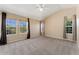 Bedroom with high ceilings, neutral carpeting, and lots of natural light at 12784 Jasmine St # E, Thornton, CO 80602