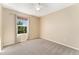 Neutral bedroom featuring natural light, carpet floors, and a ceiling fan at 12784 Jasmine St # E, Thornton, CO 80602