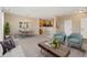 Spacious living area seamlessly connected to the dining space and kitchen, perfect for entertaining at 12784 Jasmine St # E, Thornton, CO 80602
