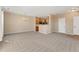 Open living space with dining area and kitchen, ideal for modern living and entertaining guests at 12784 Jasmine St # E, Thornton, CO 80602