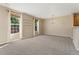 Bright open floor plan features natural lighting and neutral paint providing a blank canvas for personalization at 12784 Jasmine St # E, Thornton, CO 80602