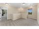 Upstairs loft area with natural light and neutral carpeting at 12784 Jasmine St # E, Thornton, CO 80602