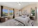 Bedroom with high ceilings, neutral carpeting, and lots of natural light at 12784 Jasmine St # E, Thornton, CO 80602