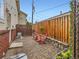 Cozy backyard with decorative screen, string lights, privacy fence, and gravel patio at 6065 Wadsworth Blvd # A, Arvada, CO 80003