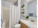 Bright bathroom with a shower-tub combo, modern vanity, and stylish decor at 6065 Wadsworth Blvd # A, Arvada, CO 80003
