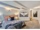 Bright bedroom featuring a comfortable queen bed, neutral walls, and ample natural light at 6065 Wadsworth Blvd # A, Arvada, CO 80003
