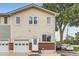 Charming two-story home with an attached garage, brick accents, and well-maintained landscaping at 6065 Wadsworth Blvd # A, Arvada, CO 80003