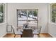 Charming dining area with sliding glass doors opening to the deck, offering a peaceful ambiance at 1580 Santa Fe Mountain Rd, Evergreen, CO 80439