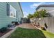 Private backyard with brick patio, grass, seating, and wood fence at 19771 E Wesley Pl, Aurora, CO 80013