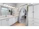 Bright bathroom featuring double vanity with granite countertops and framed mirror at 19771 E Wesley Pl, Aurora, CO 80013