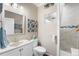 Modern bathroom featuring decorative wall, updated sink, and upgraded showerhead at 19771 E Wesley Pl, Aurora, CO 80013