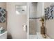 Modern bathroom featuring decorative wall and shower with upgraded showerhead at 19771 E Wesley Pl, Aurora, CO 80013