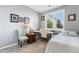 Comfortable bedroom with natural light from large window and gray walls at 19771 E Wesley Pl, Aurora, CO 80013