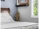 Bright bedroom with white bedding and a shelf at 19771 E Wesley Pl, Aurora, CO 80013