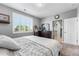 Neutral bedroom featuring bright window and decorative curtains at 19771 E Wesley Pl, Aurora, CO 80013