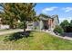 Charming home with a well-manicured front yard and inviting front porch at 19771 E Wesley Pl, Aurora, CO 80013