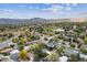 Wide aerial shot of a neighborhood showcasing well-placed homes and green spaces at 1882 S Zinnia Way, Lakewood, CO 80228