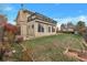 A house with a grassy backyard, a walk out basement, and a porch on the second story at 1882 S Zinnia Way, Lakewood, CO 80228