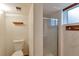A renovated bathroom with a shower, toilet, and new fixtures at 1882 S Zinnia Way, Lakewood, CO 80228