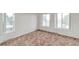 Bedroom with large windows, white walls, and carpet flooring at 1882 S Zinnia Way, Lakewood, CO 80228
