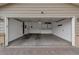 Open garage with storage cabinets for organizing tools and parking vehicles securely at 1882 S Zinnia Way, Lakewood, CO 80228