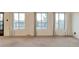 Living room with carpet flooring and a view of the deck at 1882 S Zinnia Way, Lakewood, CO 80228
