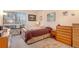 Comfortable bedroom with a large window, soft carpet, and ample storage at 9365 W 80Th Pl # C, Arvada, CO 80005