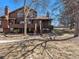 Charming exterior of brown two-story home with inviting front entry and mature trees at 9365 W 80Th Pl # C, Arvada, CO 80005