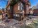 Exterior corner of home showing wood siding and surrounding ground covering at 9365 W 80Th Pl # C, Arvada, CO 80005
