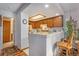 Well-maintained kitchen area featuring light wood cabinets and tile countertops at 9365 W 80Th Pl # C, Arvada, CO 80005