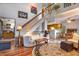 Inviting living room with vaulted ceilings, open staircase, and hardwood floors at 9365 W 80Th Pl # C, Arvada, CO 80005