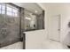 Bathroom featuring a modern shower with dual showerheads and contemporary tile work at 7214 S Shady Grove Ct, Aurora, CO 80016