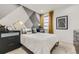 Stylized bedroom with modern decor, black furnishings, and bright natural light at 7214 S Shady Grove Ct, Aurora, CO 80016
