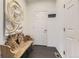 Home entry featuring hardwood floors, artistic decor, and natural lighting at 7214 S Shady Grove Ct, Aurora, CO 80016
