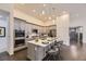 Contemporary kitchen featuring gray cabinetry, stainless steel appliances, and a center island at 7214 S Shady Grove Ct, Aurora, CO 80016