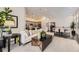 Inviting living room with open layout, connecting to the kitchen and dining area at 7214 S Shady Grove Ct, Aurora, CO 80016