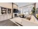 Bright living room with fireplace, built-ins, and large windows offering community views at 7214 S Shady Grove Ct, Aurora, CO 80016