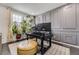 Functional home office with natural light, a large desk, and a comfortable seating area at 7214 S Shady Grove Ct, Aurora, CO 80016