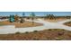 Community playground offers multiple play structures, wood chip ground cover, and nearby park benches at 7214 S Shady Grove Ct, Aurora, CO 80016