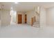 Spacious finished basement featuring neutral carpet, wooden doors, and access to the upper level at 1907 S Columbine St, Denver, CO 80210