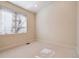 Bright bedroom with large window and blinds, neutral walls, and carpeted floors at 1907 S Columbine St, Denver, CO 80210