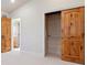 Bedroom with wood trim doors and walk-in closet with bright natural light from a window at 1907 S Columbine St, Denver, CO 80210