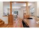 Open concept dining and living spaces, featuring hardwood floors, wood trim, and plenty of natural light at 1907 S Columbine St, Denver, CO 80210