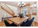 Bright dining room with staircase, offering a large table and comfortable seating, perfect for entertaining guests at 1907 S Columbine St, Denver, CO 80210